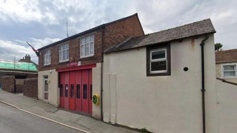 The outside of Lazonby On-Call fire station, a red and cream coloured building