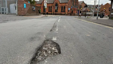7e1f3020-493a-11f1-861c-270dbba6d6ae.jpg A pothole has burst my tyre - what now and how do I claim?