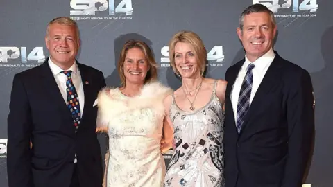 Getty Images From left to right - Scott Hastings stands next to his wife Jenny, sister-in-law Diane and brother Gavin