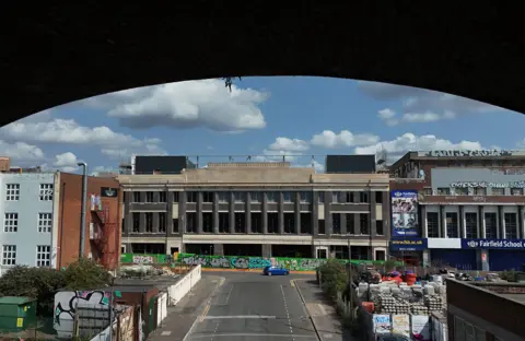 Jonathan Berg Former Typhoo tea factory is an industrial building flanked by other factories in the Digbeth area of Birmingham