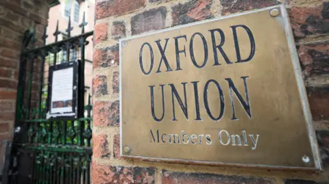 Getty Images A 'members only' sign hangs on the wall outside the Oxford Union, part of Oxford University, in Oxford.
