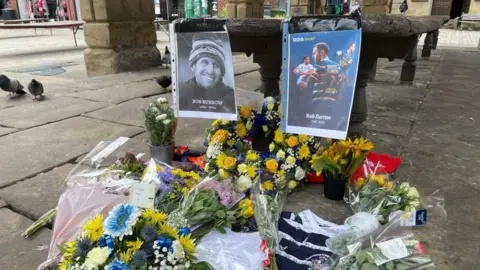 Jack Hadaway-Weller/BBC Tributes to Rob Burrow left at Pontefract Buttercross