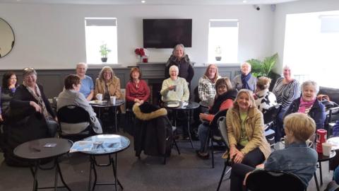 Joanne Smith with FACT volunteers and service users at a recent coffee morning 