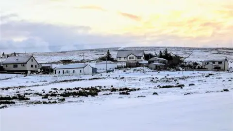 BBC Weather Watchers/Jeannie Buildings and fields covered by snow in the Shetland Isles