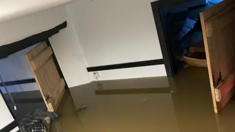 Billy Vernon A room of a house showing brown water about half was up the wall. 