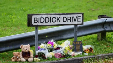 PA Media Tributes left under a Biddick Drive street sign