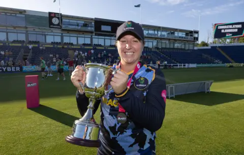 Glamorgan captain Lauren Parfitt lifting the Vitality Women's T20 Blast League 2 trophy after defeating Gloucestershire.