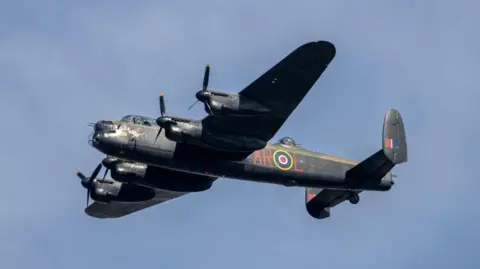 Getty Images A picture of a Lancaster bomber flying over Milton Keynes in September 2023