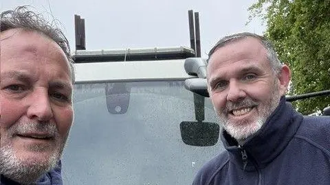 Garry Wall Garry Wall (left) and project manager Paul Rush of HW Martin standing in front of  van.