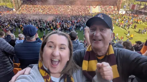 Fay Beesley A selfie shot of a daughter and her father both wearing claret and amber scarves at the final game of Bradford City Football Club's latest season.