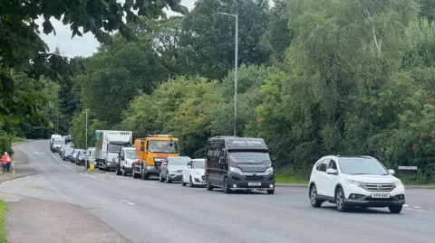 A queue of cars heading along the A701 outside Dumfries