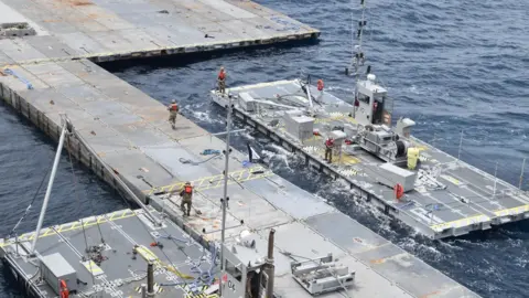 US military handout photo showing floating pier being constructed off the coast of Gaza (6 May 2024)
