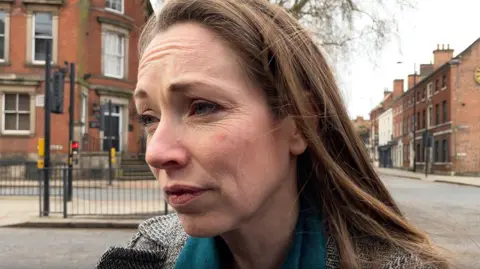 Catherine Atkinson, Labour MP for Derby North, at the scene in Friar Gate, Derby, on Sunday.