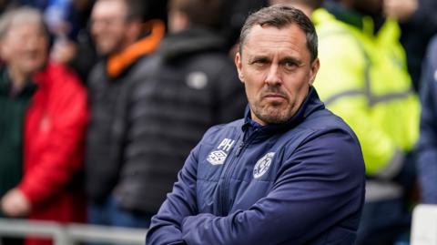 Shrewsbury Town manager Paul Hurst looks on from the touchline
