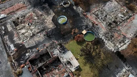 Reuters A drone view of buildings destroyed by a wildfire in Le Porge