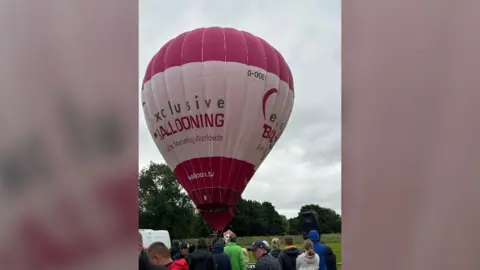 Shirley Howarth Pink and white hot air balloon on the ground