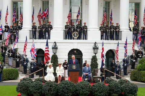 Getty Images U.S. President Donald Trump speaks onstage with Queen Camila, First lady Melania Trump and King Charles III during a state arrival ceremony on the South Lawn of the White House on April 28, 2026 in Washington, DC. 