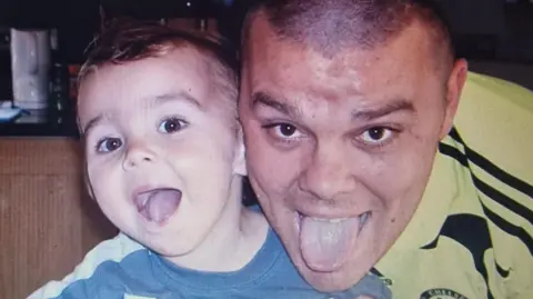 An old photo of Martin Cosser with his son Charlie.