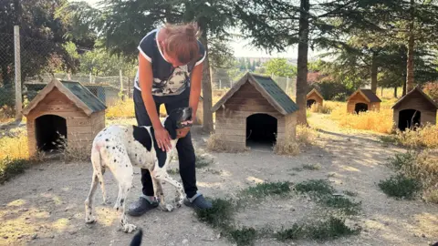 Gokcen Yildiz and a dog