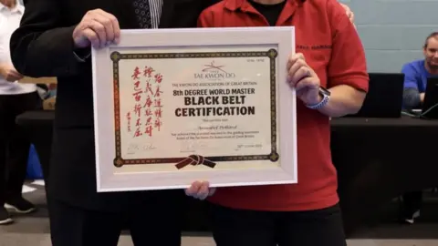 Annabel Murcott Certificate awarded to Annabel Murcott promoting her to 8th Dan black belt