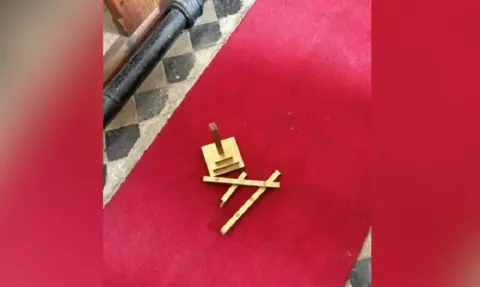 Horncastle, Spilsby & Woodhall Spa Police/X One of the main alter crosses left on the red floor after being broken