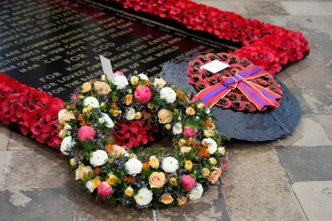 Jordan Pettitt/Pool via REUTERS Wreaths laid by King Charles on behalf of the Nation and the Commonwealth, and the Prince of Wales and on behalf of Veterans and the Second World War generation, at the Grave of the Unknown Warrior are pictured, during a Service of Thanksgiving at Westminster Abbey in London on the 80th anniversary of VE Day.