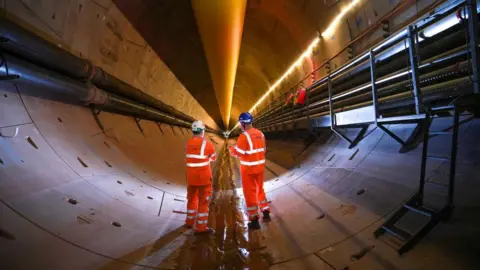 Engineers inspect the progress of a boring machine in an HS2 tunnel in  Water Orton, Warwickshire 