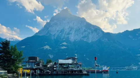 Byrne family Mountain - Gitschen mountain - in Switzerland, with water in the foreground.