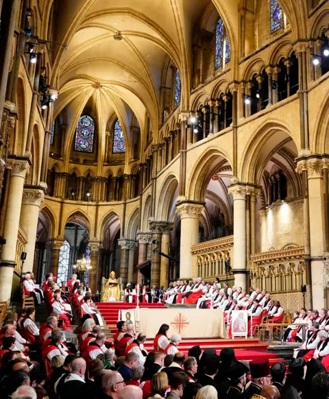 Jordan Pettitt / PA Media A portrait view of the cathedral with the congregation at the bottom of frame