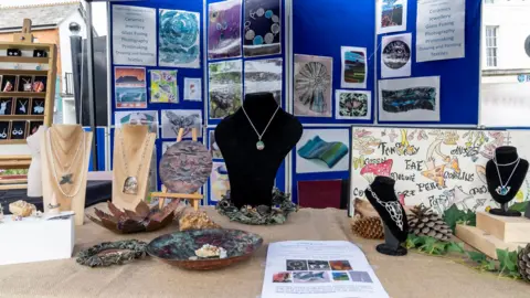 Cornwall Council Products produced by students including jewellery and textiles on display