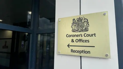 A sign outside Suffolk Coroner's Court