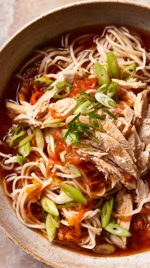 Top down view of kimchi chicken ramen in a bowl