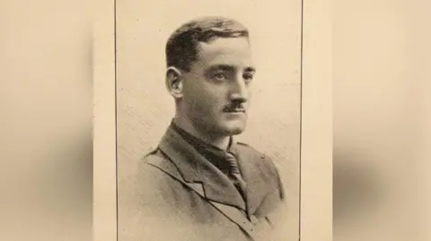 Durham Cathedral Foundation A sepia photograph from the early 1900s shows a three-quarter profile of a man. He has short hair and a neat moustache and is wearing what appears to be some form of a uniform.