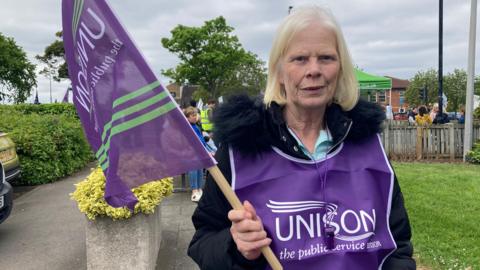 A healthcare worker taking part in strike action in Middlesbrough