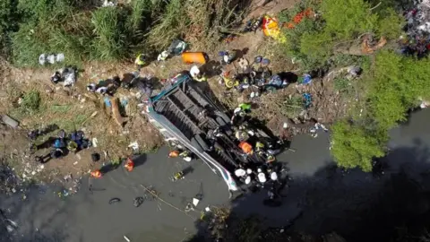 Reuters A drone view shows first responders working at the site of a deadly bus crash, in Guatemala City, Guatemala February 10, 2025.