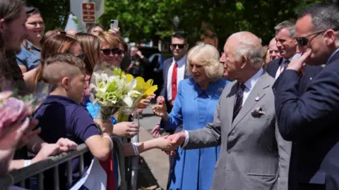 Reuters King Charles and Queen Camilla shake hands and greet wellwishers lining a street in the small town of Front Royal in Virginia, on the last day of their state visit to the US