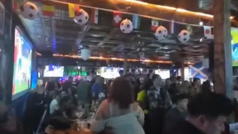 Supplied A view of a pub decorated with football and World Cup flags