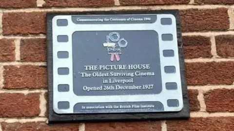 Sign outside the cinema stating it is the oldest surviving cinema in Liverpool.