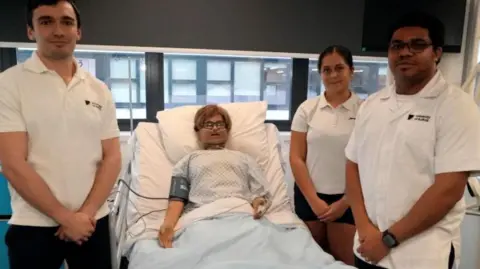 Qays Najm/BBC Phil Powell, 26, from Newmarket, second year physiotherapy student, Amy Prendergast, 19, from Southend, second year physiotherapy student, Serenu Vite, 27, from Ipswich, second year Msc Adult nursing student and a hospital dummy