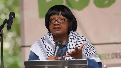 Diane Abbott speaking at the People's Assembly Against Austerity protest in central London in June 2025