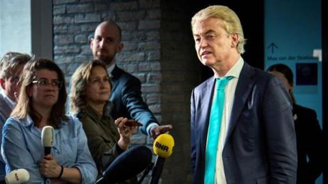 Dutch far-right PVV party leader Geert Wilders speaks to the press before the start of follow-up government formation talks in April 2024
