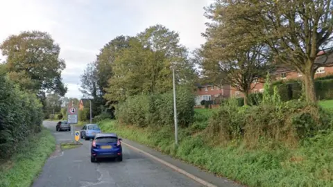 Google The road is on the edge of a housing area