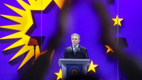 Reuters Bidzina Ivanishvili, founder of the Georgian Dream party, speaks at the final campaign rally organized by the party's supporters ahead of parliamentary elections in Tbilisi, Georgia, on October 23, 2024.