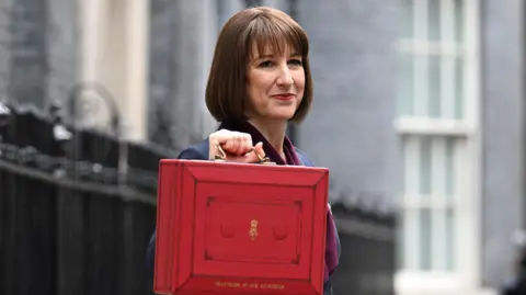Jeff Overs/BBC Chancellor of the Exchequer Rachel Reeves outside 11 Downing Street on Budget Day, 30/10/2024. With her Autumn Budget red ministerial budget box.