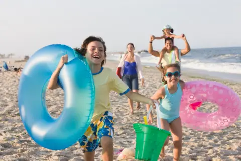 Getty Images A family on holiday at a beach