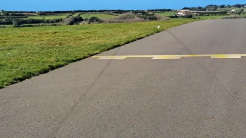 Tyre marks on the runway from where the aircraft left the paved surface