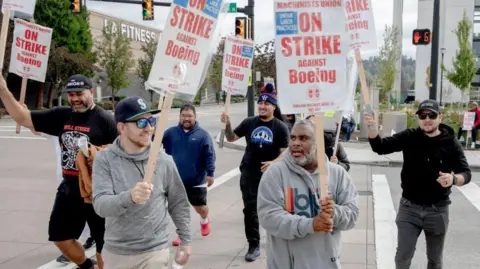 Getty Images Striking Boeing workers and their supporters picket outside the Boeing Co. manufacturing facility in Renton, Washington on 16 September, 2024. 