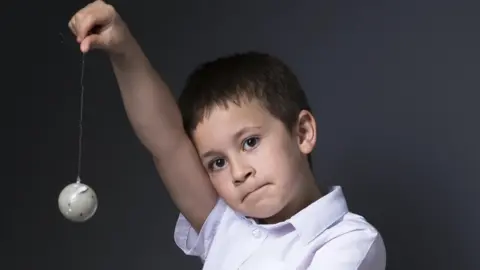 Lyndsay Smith Aston Smith with planet on a string