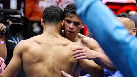 Rolando Romero and Ryan Garcia hug