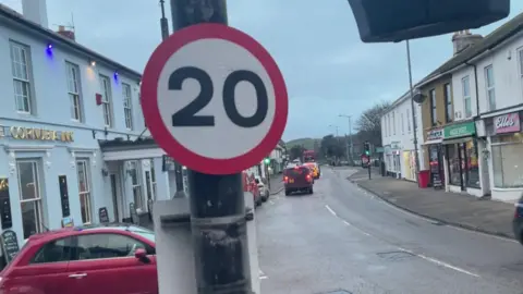 Road sign in Hayle showing new lower limit 